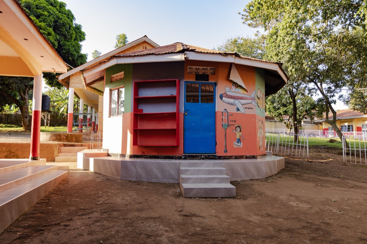 A round, painted classroom building